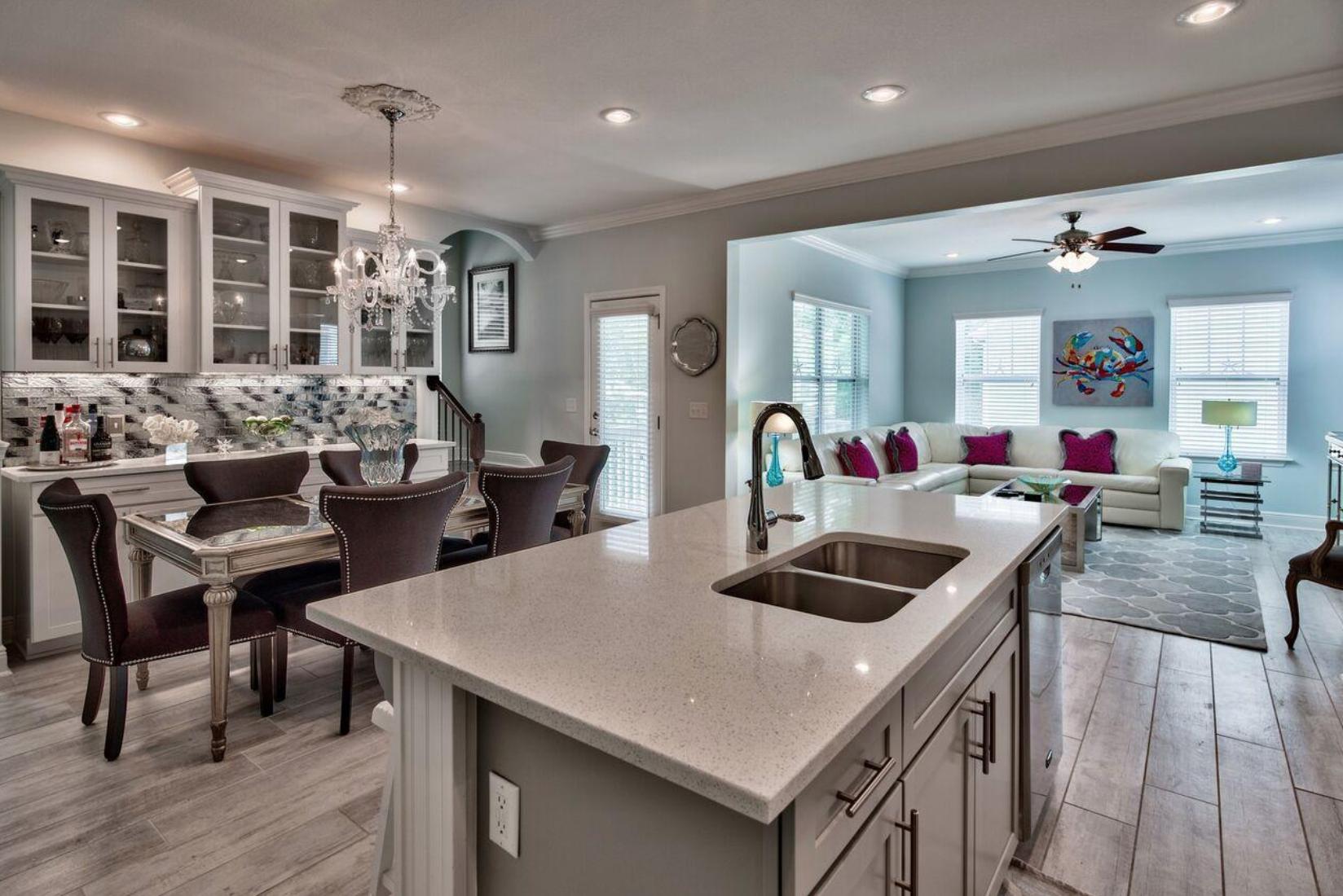 66 Sandpine Loop Inlet Beach, FL 32461 - Photo 12 of 41 a kitchen island with granite countertop a table and chairs