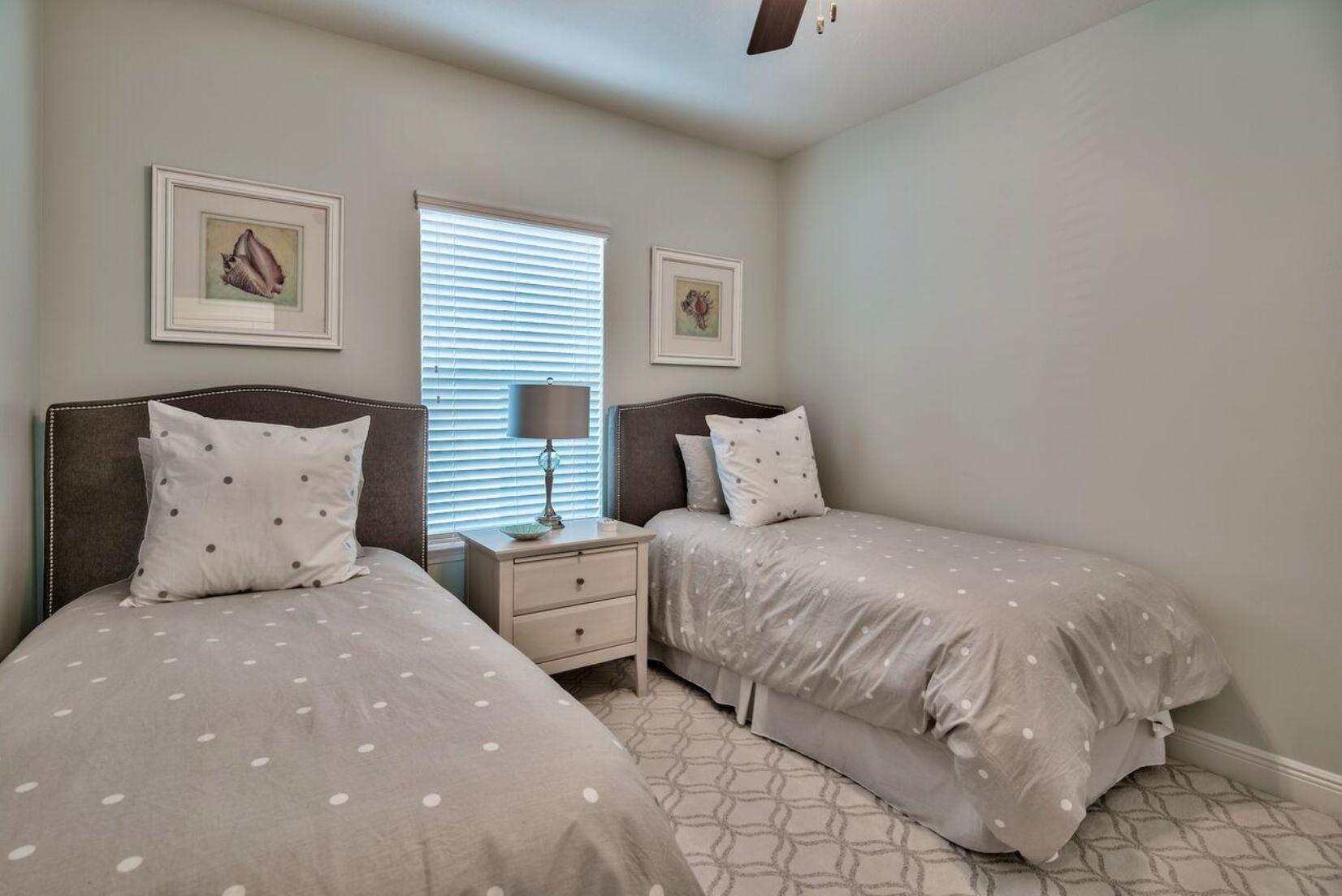 66 Sandpine Loop Inlet Beach, FL 32461 - Photo 21 of 41 a bedroom with a bed and painting on the wall
