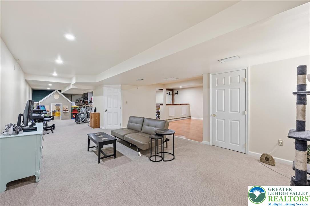 2011 Fieldview Drive Nazareth, PA 18064 - Photo 37 of 52 A spacious, carpeted lower level offers flexible space for recreation and entertainment, with a dedicated area for creative pursuits.