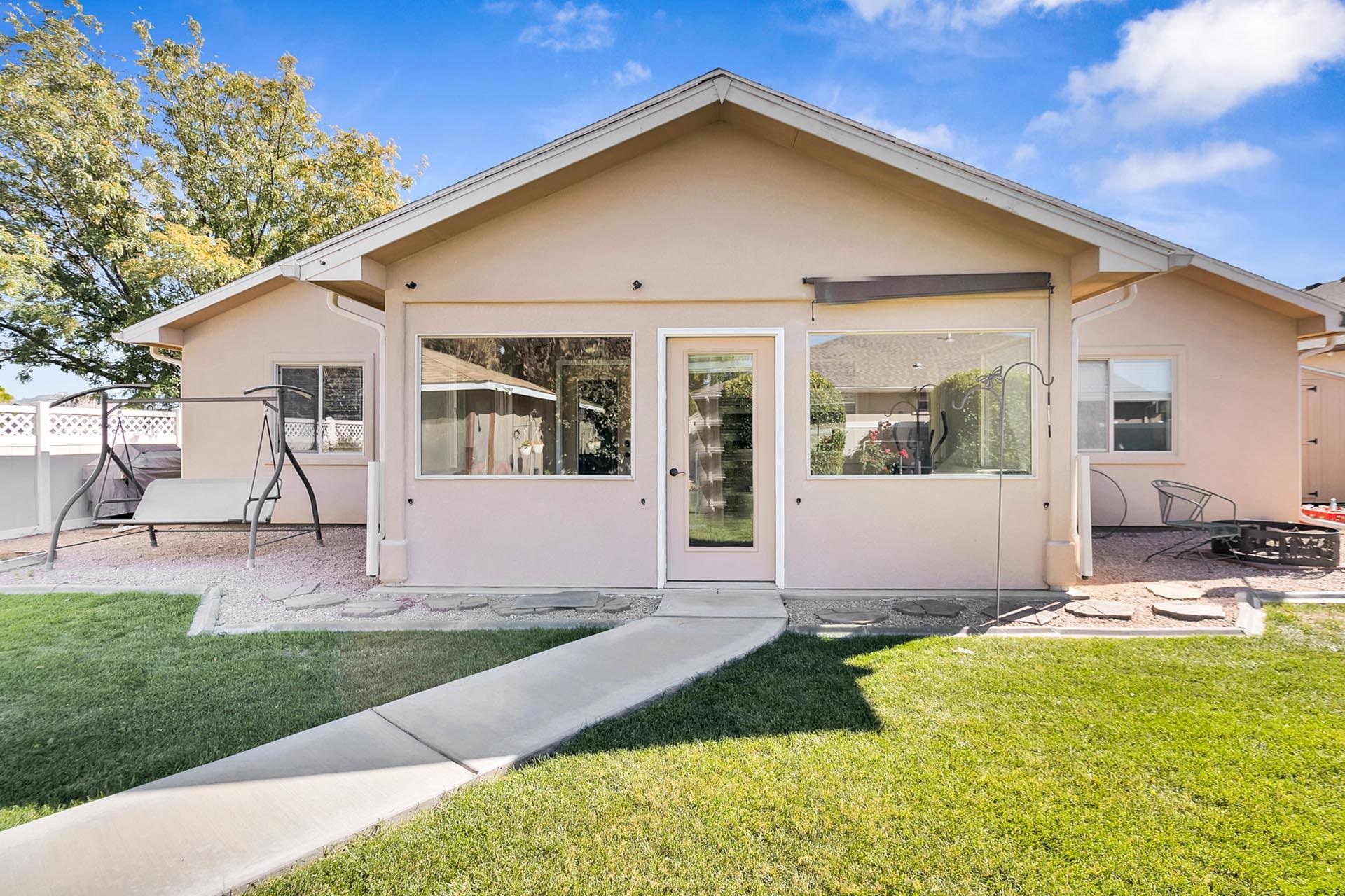247 Mason Ridge Drive Grand Junction, CO 81503 - Photo 13 of 40 a front view of a house with garden
