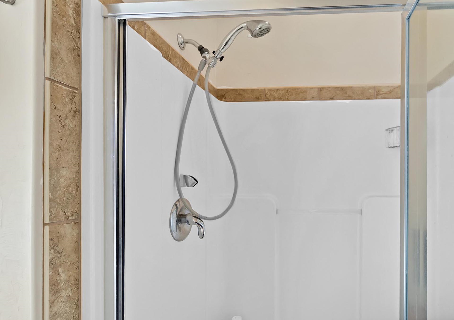 247 Mason Ridge Drive Grand Junction, CO 81503 - Photo 28 of 40 a bathroom with a shower and a mirror