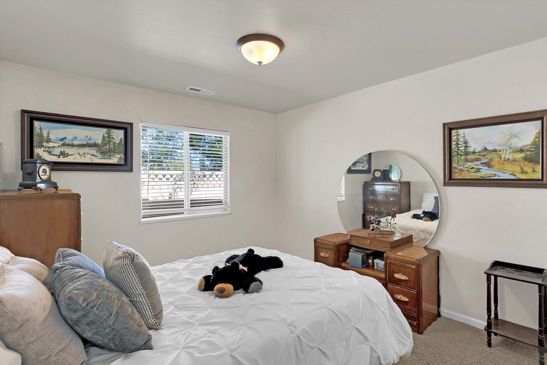 247 Mason Ridge Drive Grand Junction, CO 81503 - Photo 31 of 40 a bedroom with a bed and a window