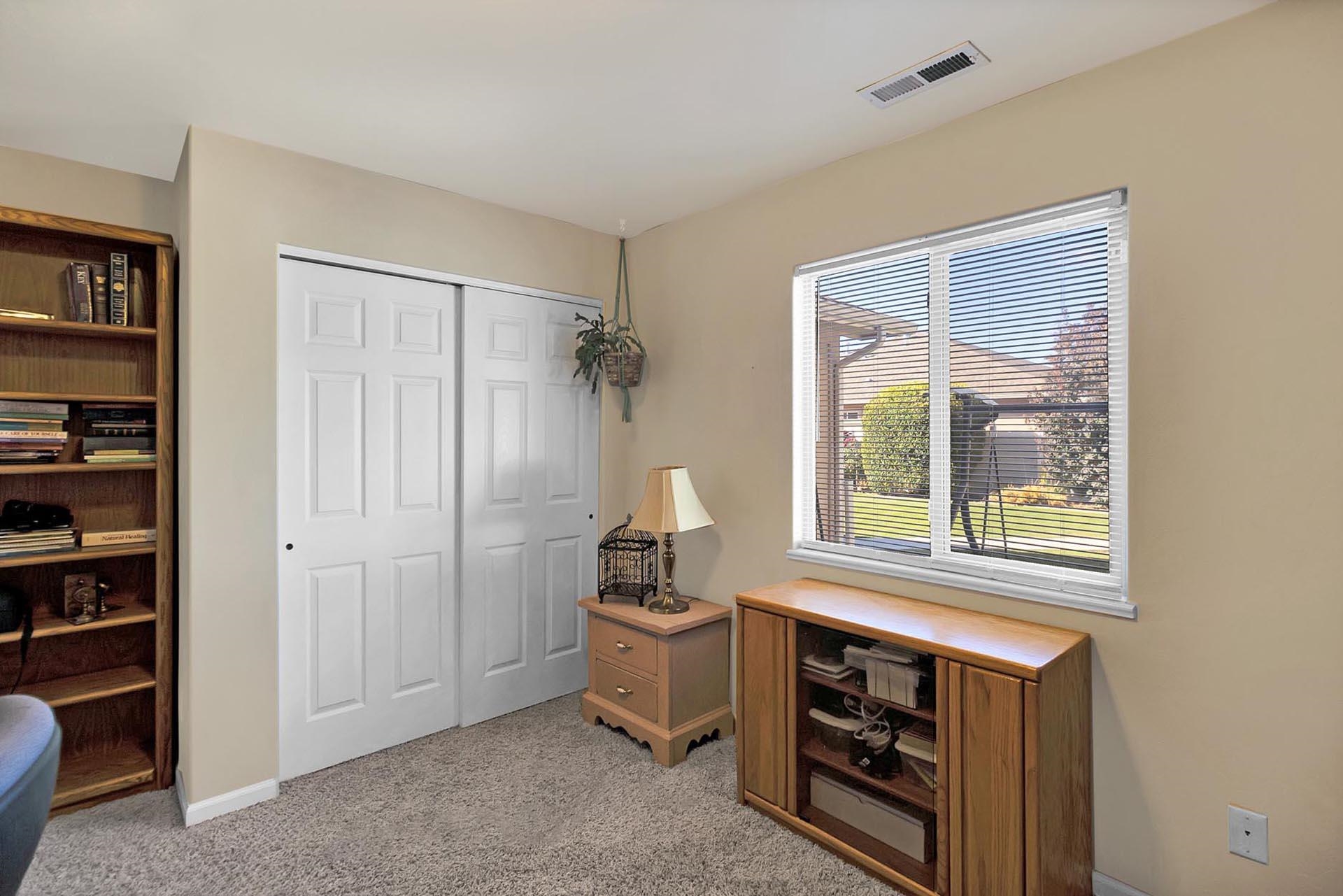 247 Mason Ridge Drive Grand Junction, CO 81503 - Photo 35 of 40 a room that has a window and a table in it