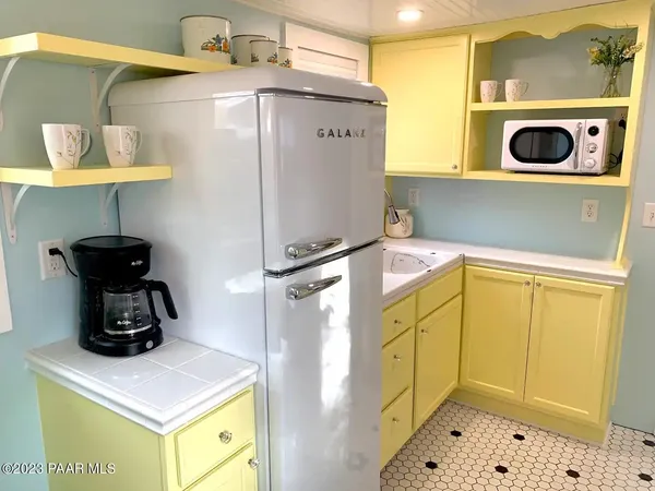 a bathroom with a sink a mirror and shower