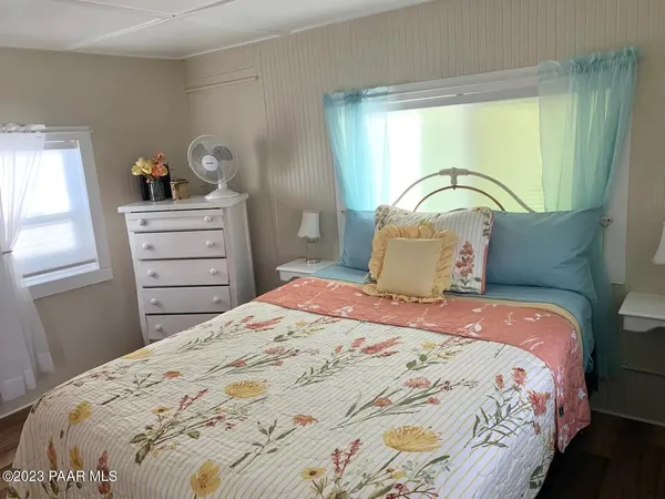 a bedroom with a bed and a dresser