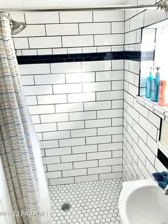 a bathroom with a sink and a shower