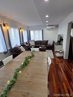 12-14 West 5th Road Queens, NY 11693 - Photo 25 of 43 Dining area featuring dark wood-style flooring, recessed lighting, and an AC wall unit