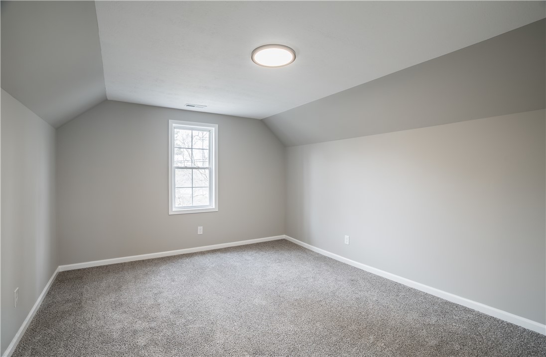8240 Looney Road Piqua, OH 45356 - Photo 25 of 49 This versatile room offers plush carpet and abundant natural light, perfect for any use.