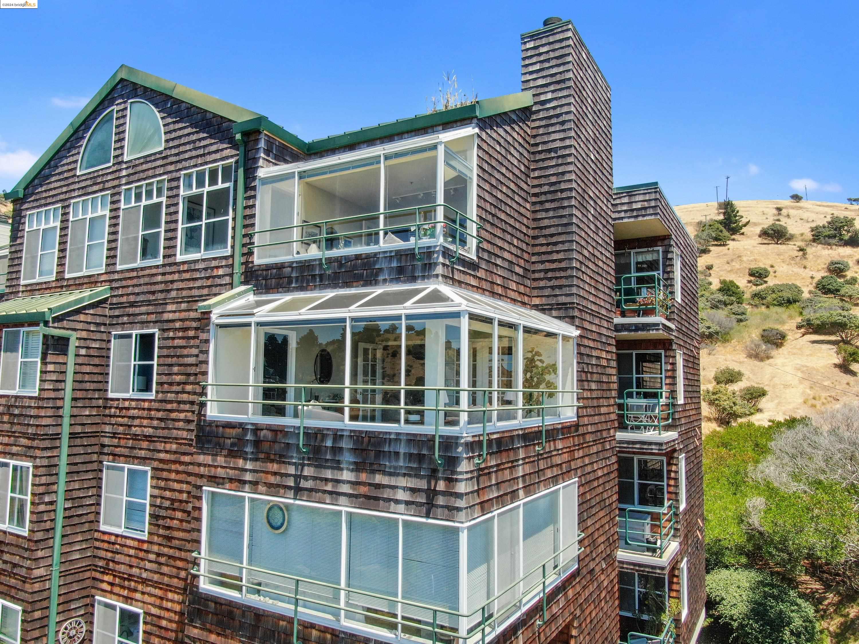 1200 Brickyard Way, Unit 316 Richmond, CA 94801 - Photo 1 of 1 a front view of a house with a yard