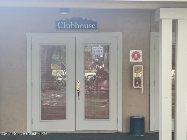 a view of swimming pool with outdoor seating and plants