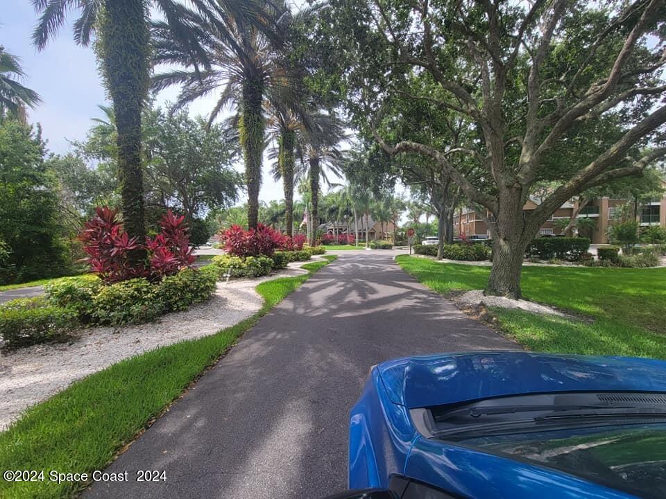 7667 North Wickham Road, Unit 601 Melbourne, FL 32940 - Photo 4 of 21 a view of a backyard with sitting area