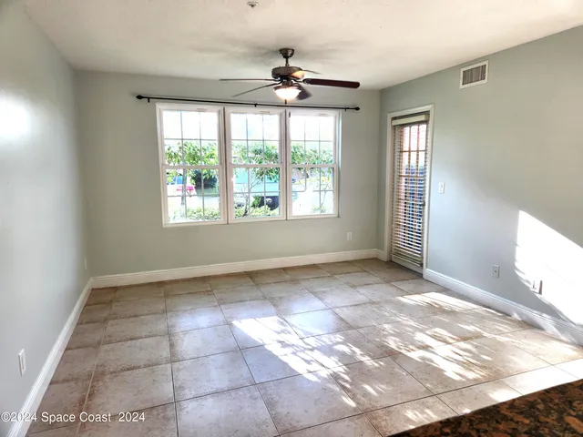 a view of an empty room and a window