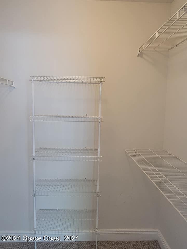 7667 North Wickham Road, Unit 601 Melbourne, FL 32940 - Photo 10 of 21 a view of an empty walk in closet