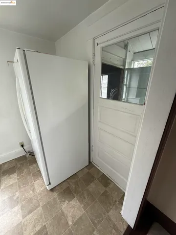 a kitchen with a sink a stove top oven and cabinetry