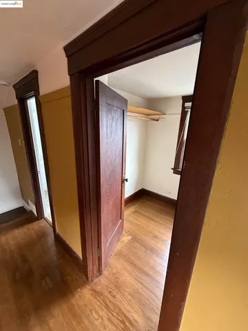 a bathroom with a bathtub and mirror