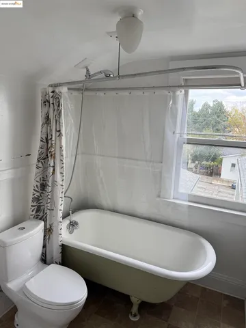 a bathroom with a sink mirror and toilet