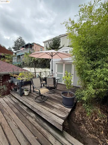a view of a patio with table and chairs and potted plants