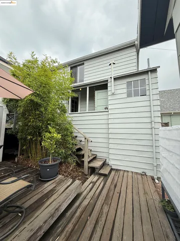 a view of a patio with wooden floor