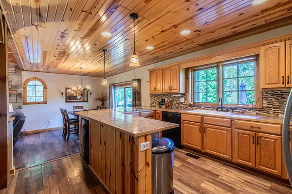 a kitchen with a table and chairs in it