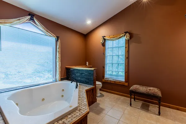 a room that has a dresser and a mirror in it