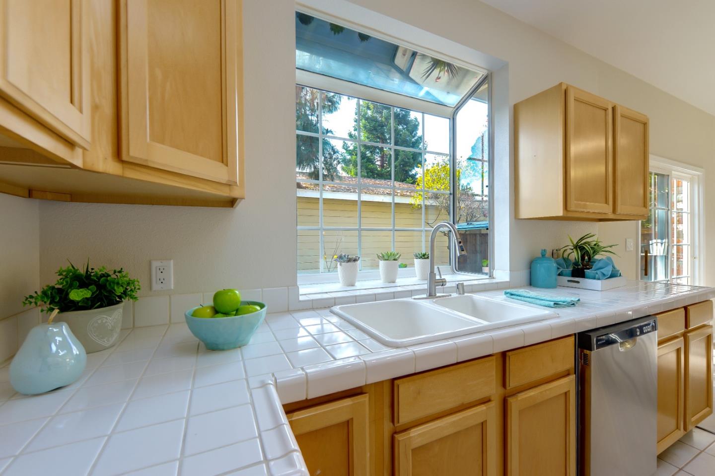 682 Willowgate Street Mountain View, CA 94043 - Photo 11 of 30 a kitchen with a sink a window and cabinets