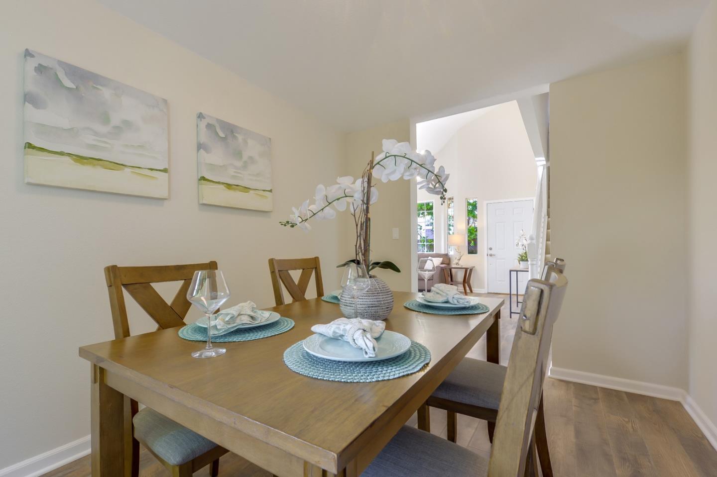 682 Willowgate Street Mountain View, CA 94043 - Photo 13 of 30 a view of a dining room with furniture and wooden floor