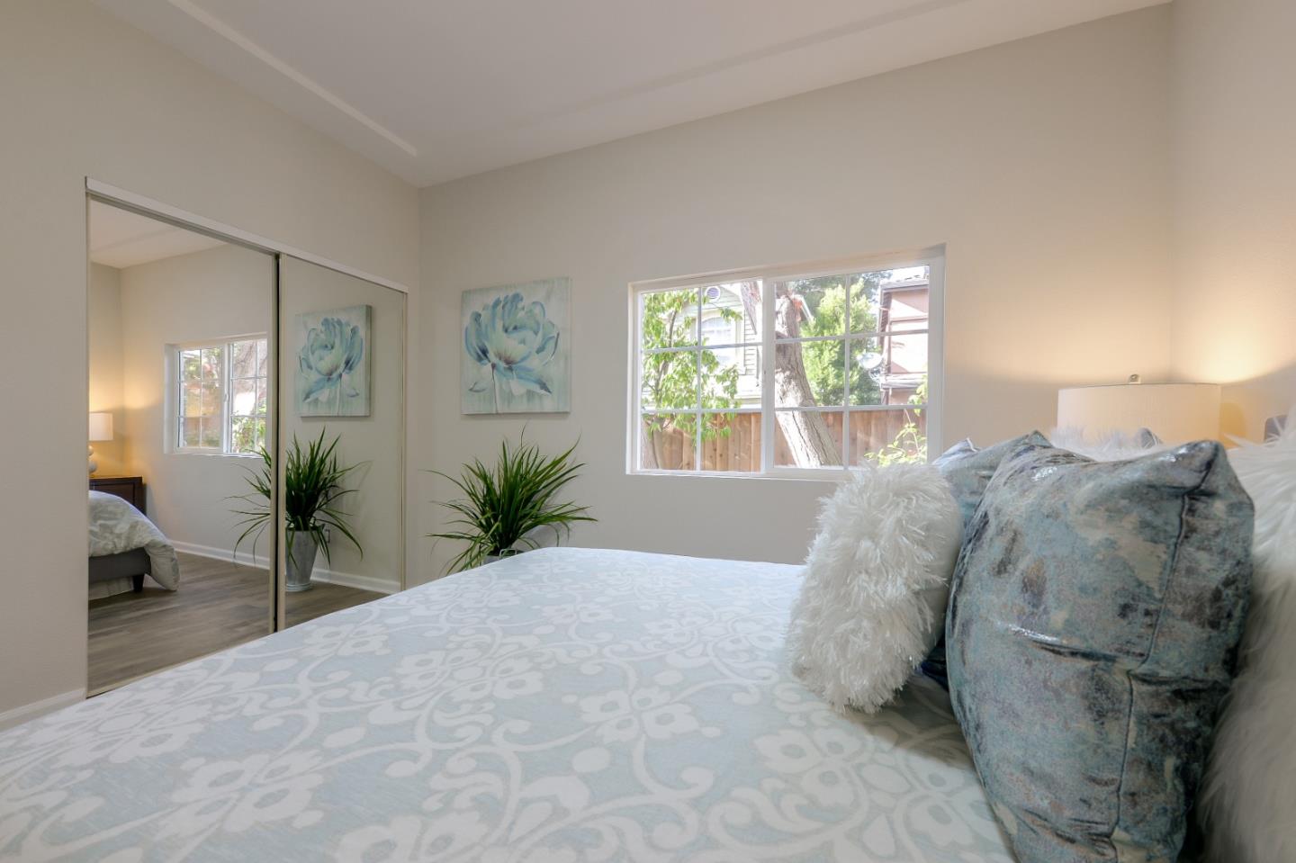 682 Willowgate Street Mountain View, CA 94043 - Photo 18 of 30 a bed room with a bed and a large window