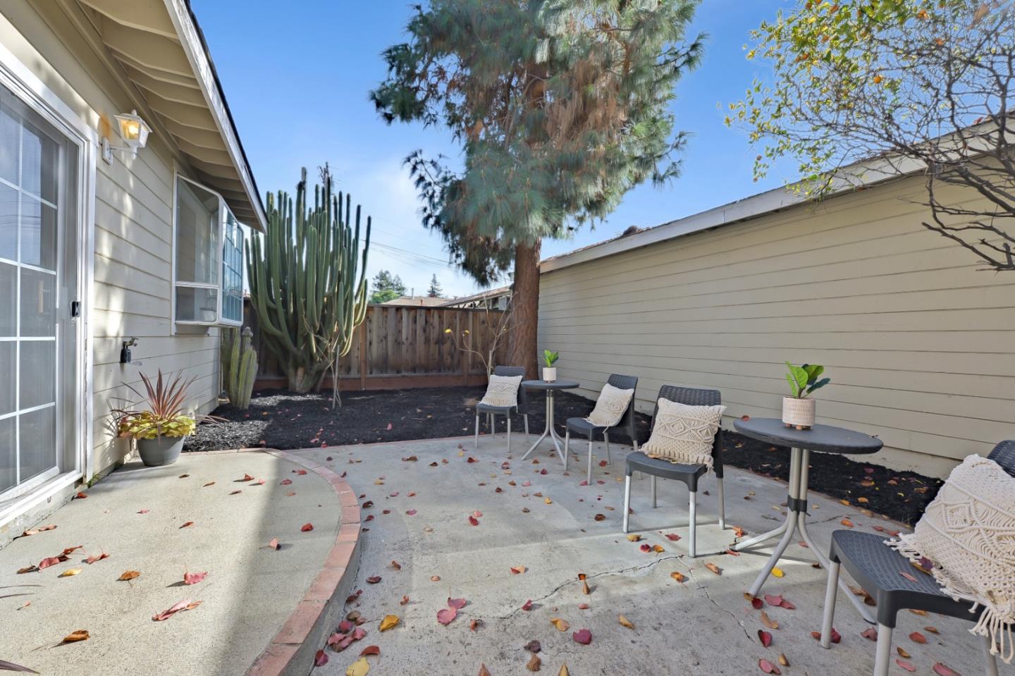 682 Willowgate Street Mountain View, CA 94043 - Photo 29 of 30 a view of a patio with a table and chairs