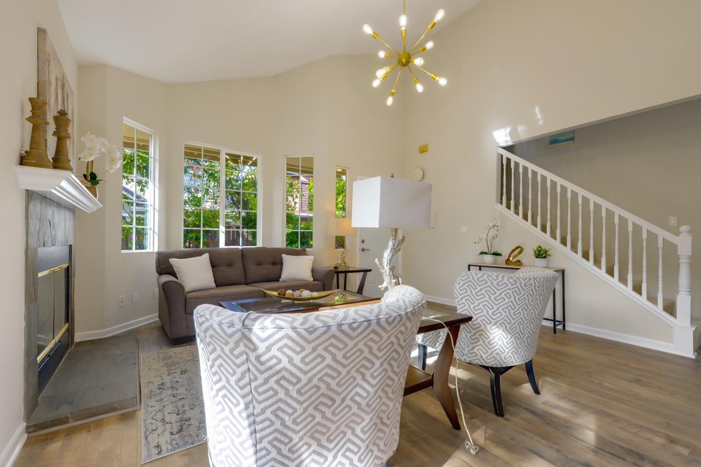 682 Willowgate Street Mountain View, CA 94043 - Photo 6 of 30 a living room with furniture and a fireplace