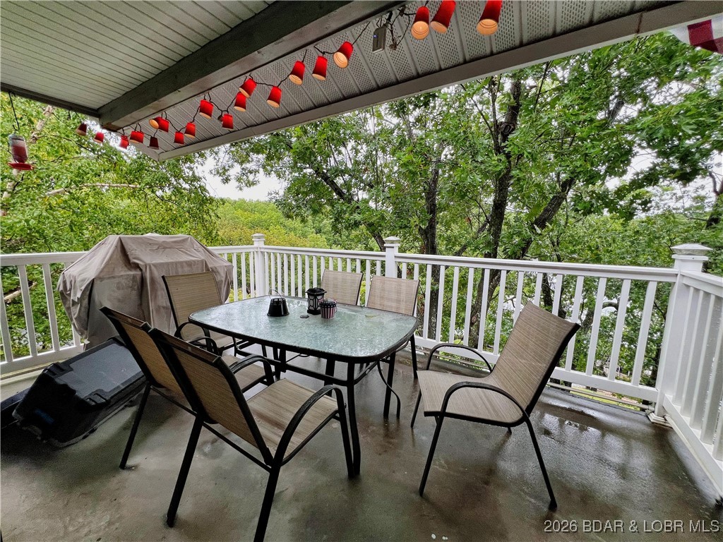1505 Swiss Village Road, Unit A5 Osage Beach, MO 65065 - Photo 11 of 41 Concrete decking and vinyl railings means maintena