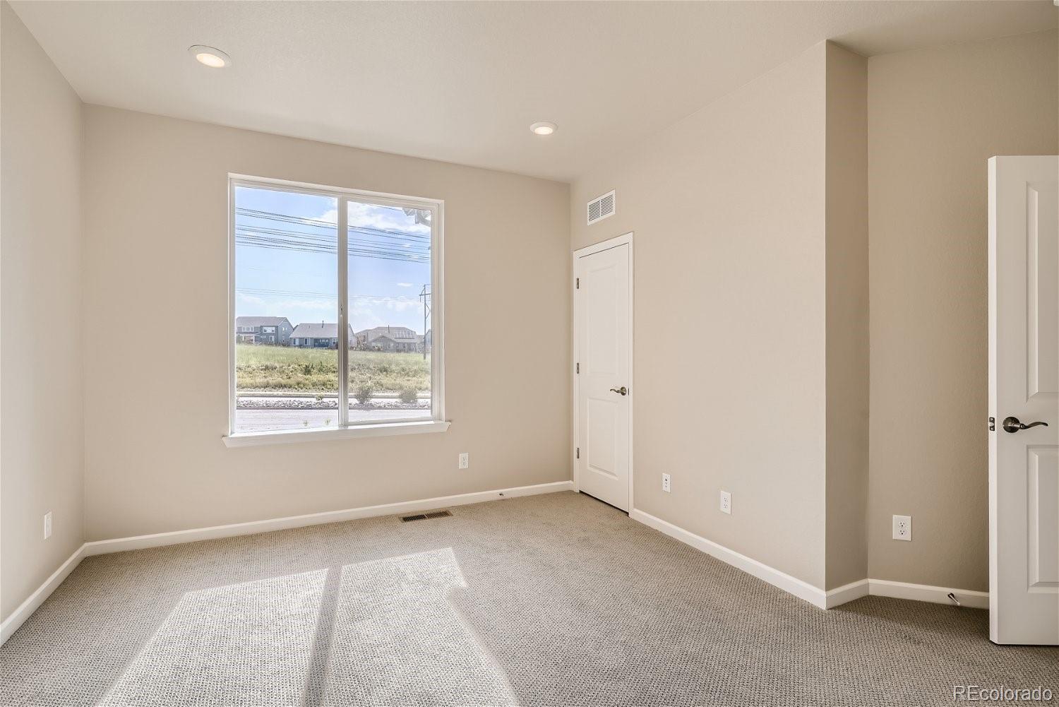 6700 Merseyside Lane Castle Pines, CO 80108 - Photo 14 of 28 a view of an empty room with a window