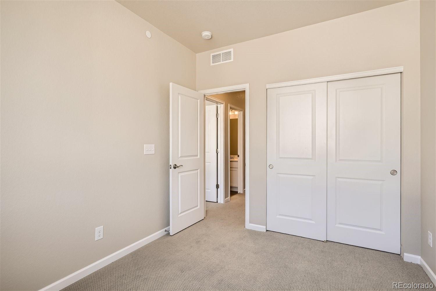 6700 Merseyside Lane Castle Pines, CO 80108 - Photo 19 of 28 an empty room with closet area