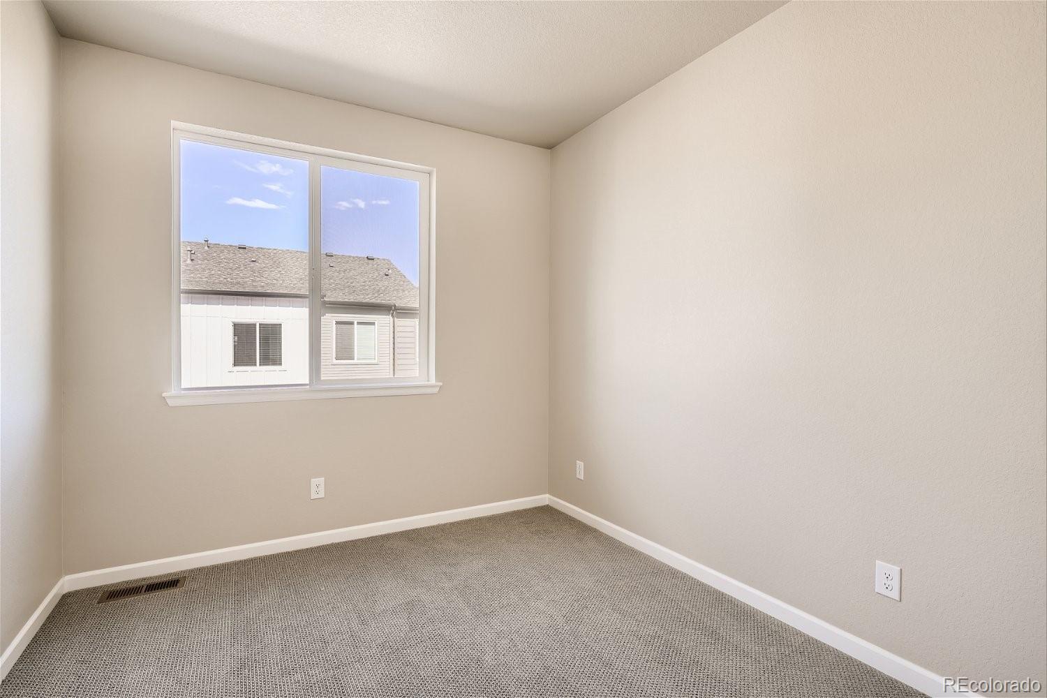 6700 Merseyside Lane Castle Pines, CO 80108 - Photo 20 of 28 a view of an empty room with a window