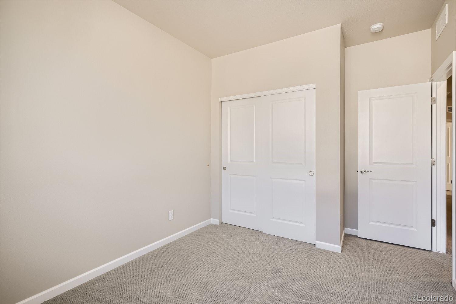 6700 Merseyside Lane Castle Pines, CO 80108 - Photo 21 of 28 an empty room with closet area