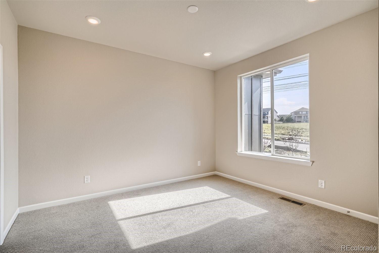 6700 Merseyside Lane Castle Pines, CO 80108 - Photo 9 of 28 an empty room with a window
