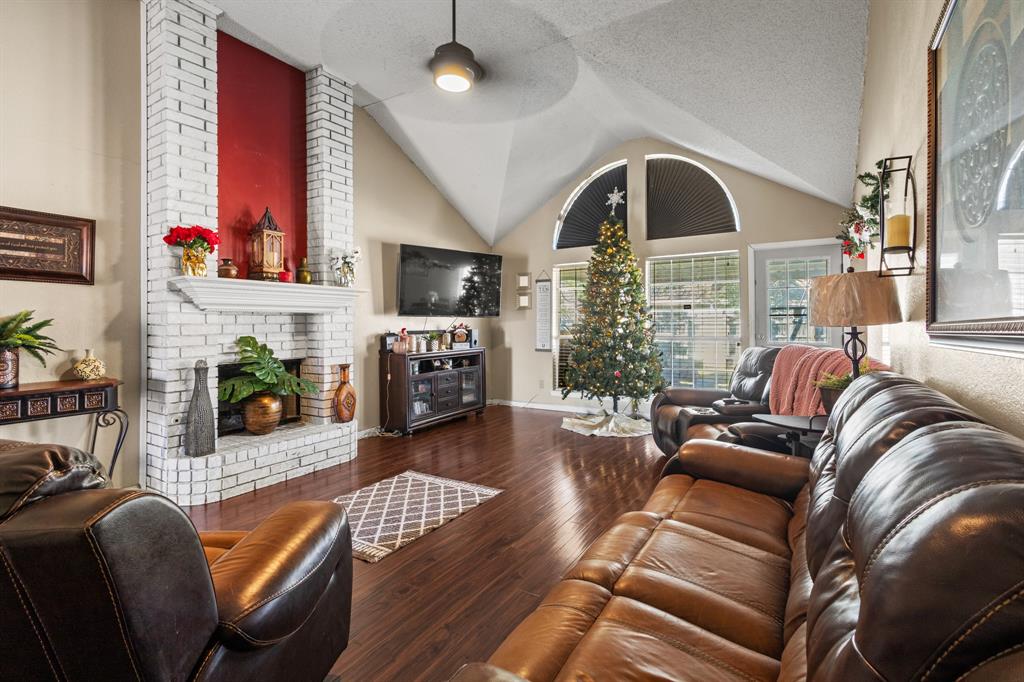 3717 Corn Valley Road Grand Prairie, TX 75052 - Photo 2 of 14 a living room with furniture fireplace and flat screen tv