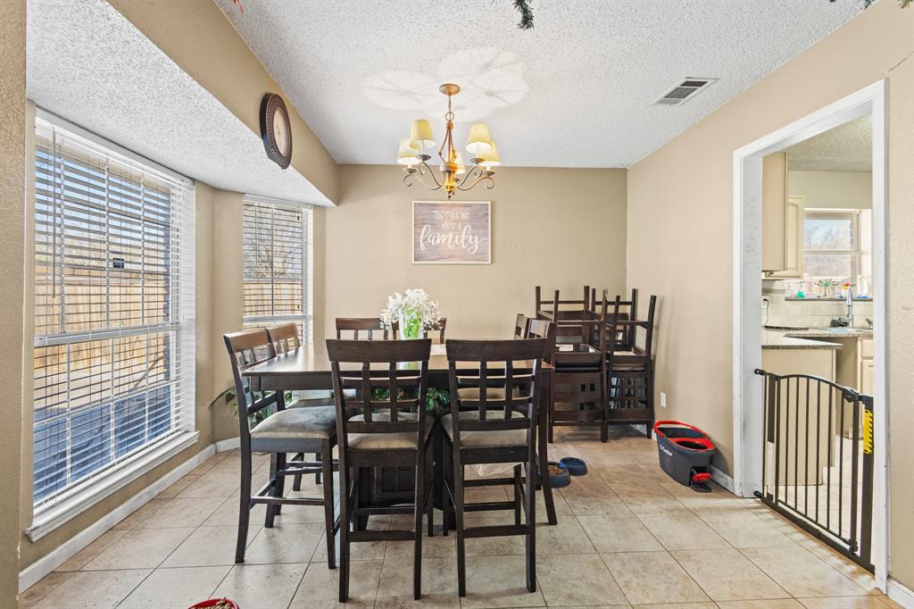 3717 Corn Valley Road Grand Prairie, TX 75052 - Photo 5 of 14 a view of a dining room with furniture window and outside view