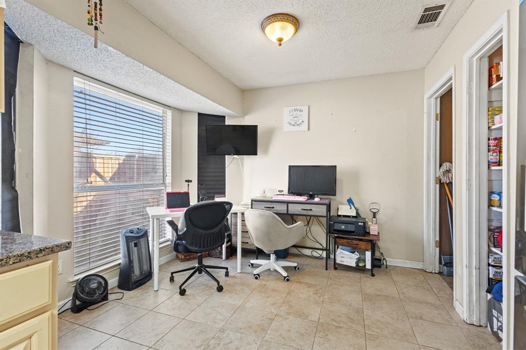 3717 Corn Valley Road Grand Prairie, TX 75052 - Photo 7 of 14 a view of a workspace with furniture and a window