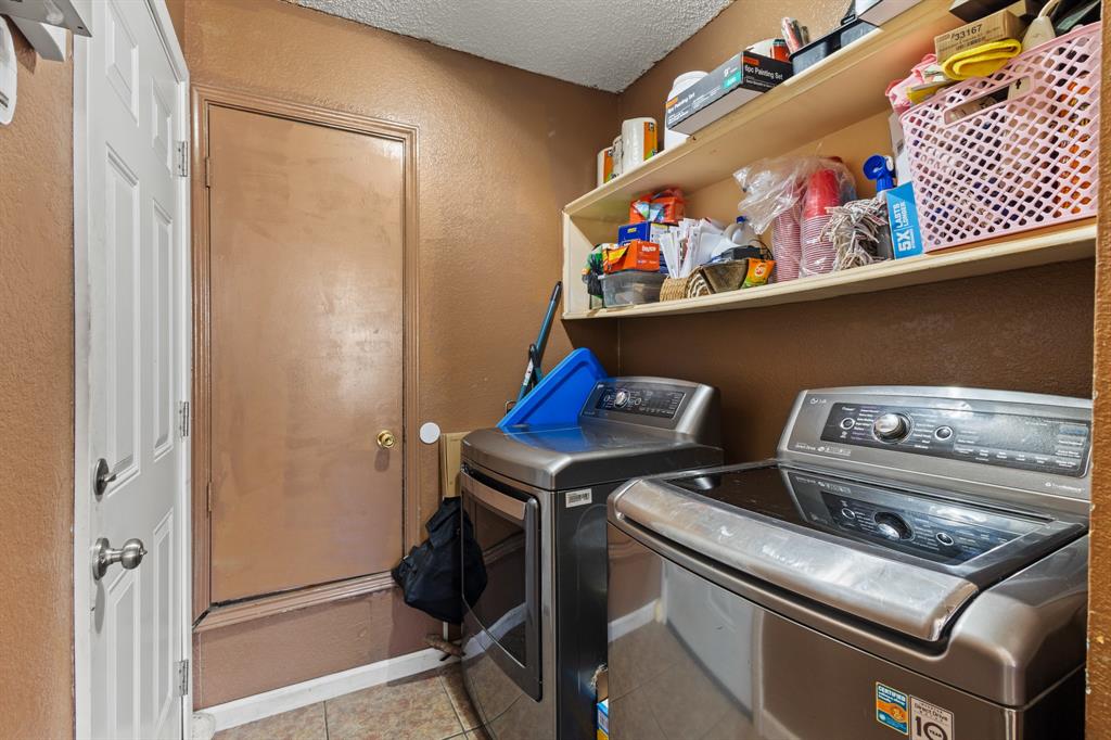 3717 Corn Valley Road Grand Prairie, TX 75052 - Photo 8 of 14 a room with storage and utility