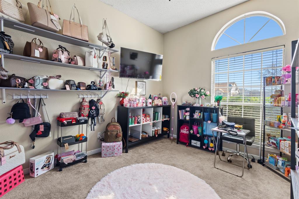 3717 Corn Valley Road Grand Prairie, TX 75052 - Photo 10 of 14 a room with storage and a white furniture