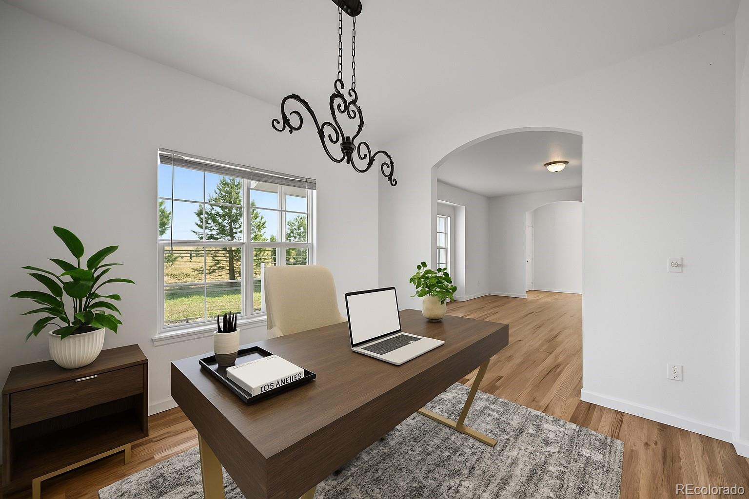 7498 Patrick Trail Elizabeth, CO 80107 - Photo 12 of 44 a living room with furniture and window