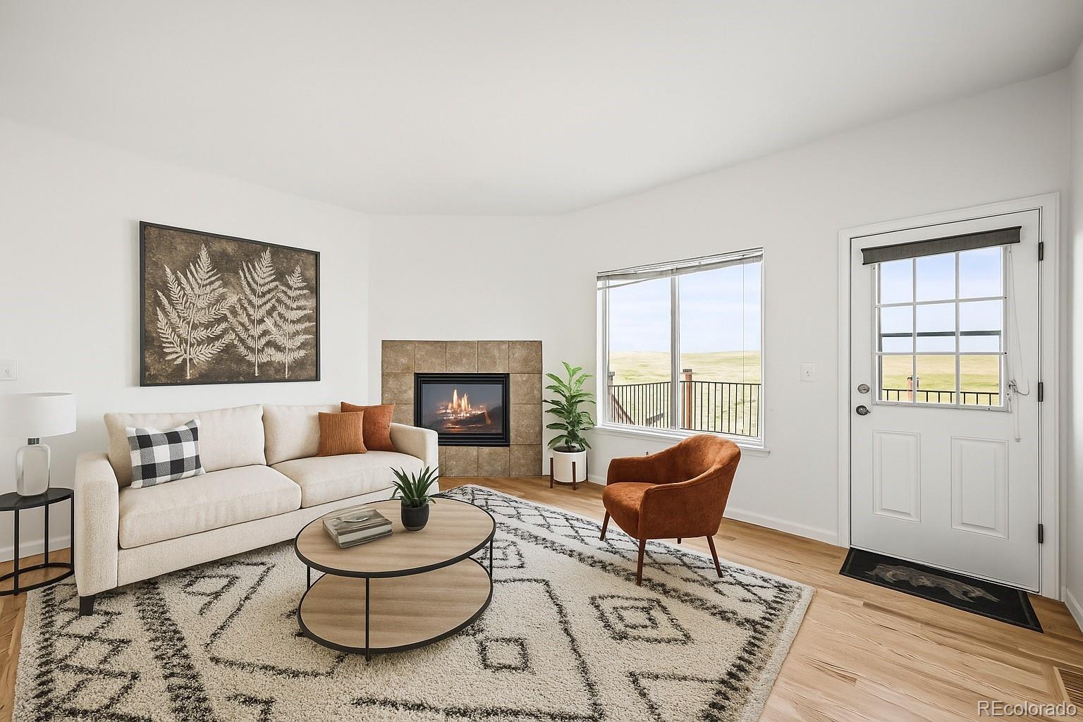 7498 Patrick Trail Elizabeth, CO 80107 - Photo 12 of 45 a living room with furniture and a fireplace
