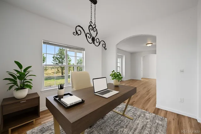 a living room with furniture and window