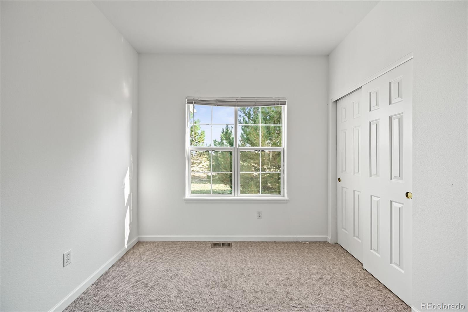 7498 Patrick Trail Elizabeth, CO 80107 - Photo 21 of 44 an empty room with a window