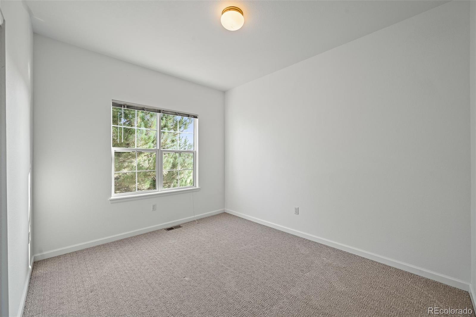 7498 Patrick Trail Elizabeth, CO 80107 - Photo 22 of 44 an empty room with a window