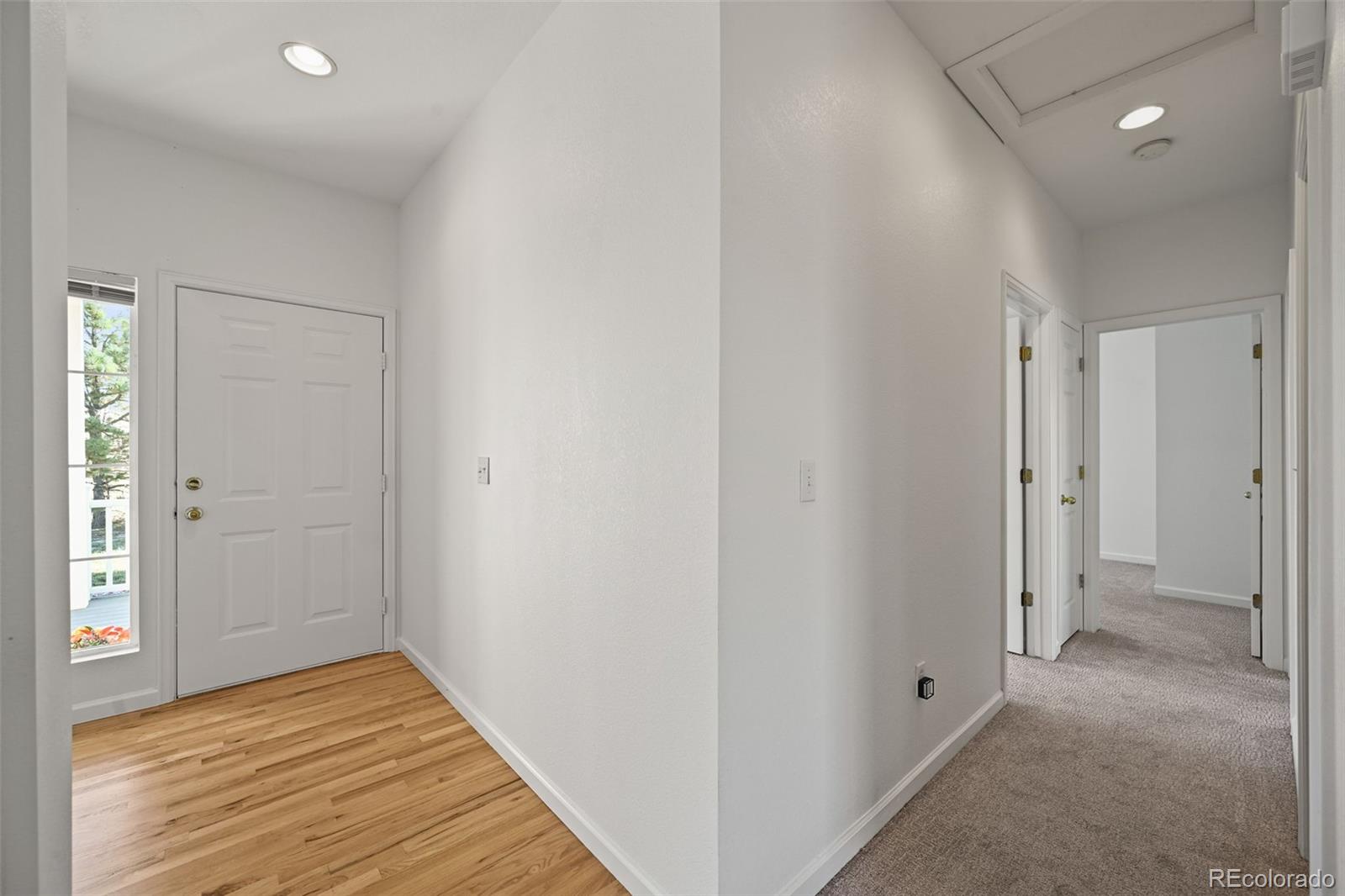 7498 Patrick Trail Elizabeth, CO 80107 - Photo 23 of 44 a view of a hallway with wooden floor