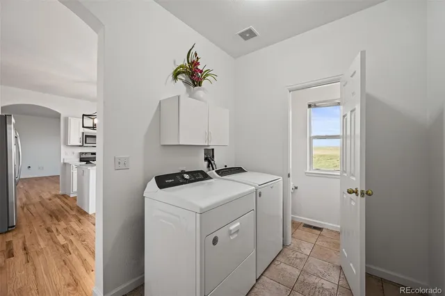 a view of a storage and utility room with a window