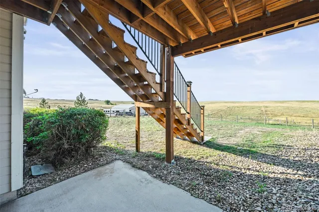 a view of a pathway of a building next to a yard