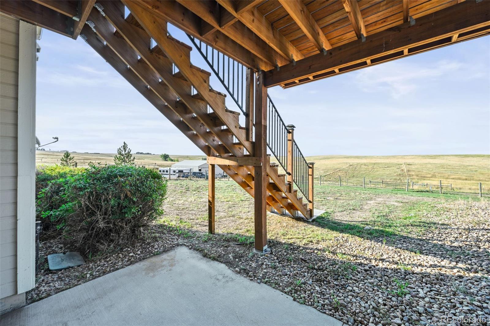 7498 Patrick Trail Elizabeth, CO 80107 - Photo 30 of 45 a view of a pathway of a building next to a yard