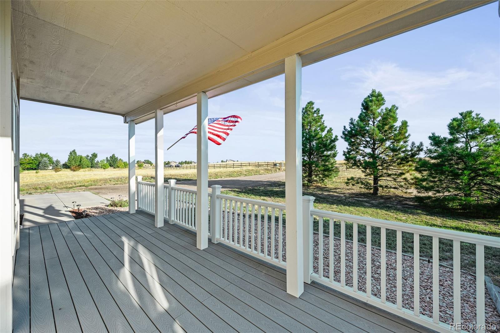 7498 Patrick Trail Elizabeth, CO 80107 - Photo 3 of 45 a view of a balcony with wooden floor